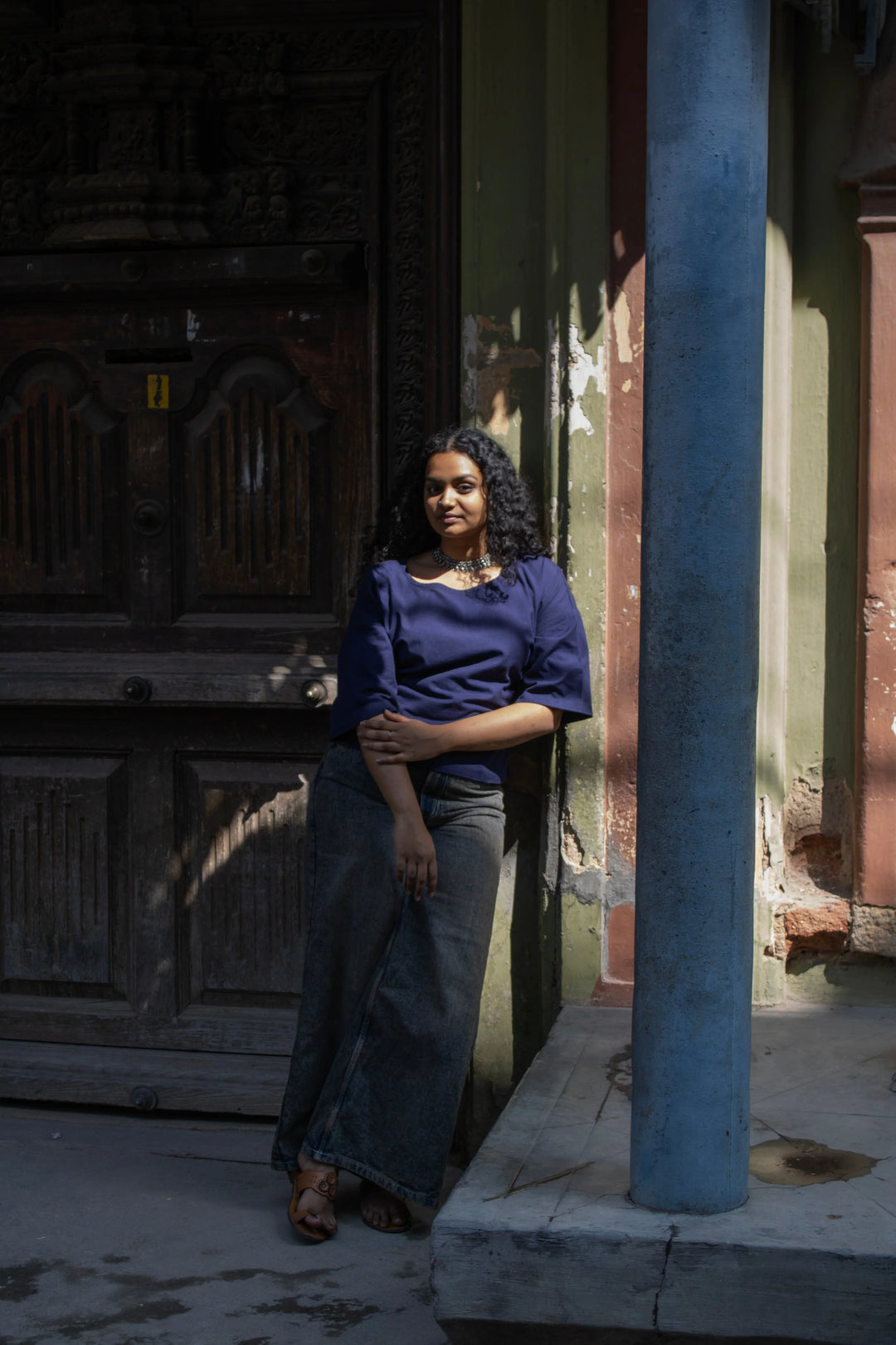 Model wearing an indigo cotton crop top paired with a baggy denim.